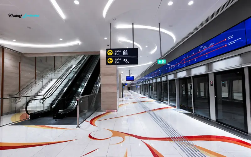 Dubai Investment Park 1 Metro Station interior with escalators and platform screen doors
