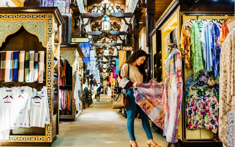 Naif Market Dubai where visitors buy traditional clothes, scarves and textiles